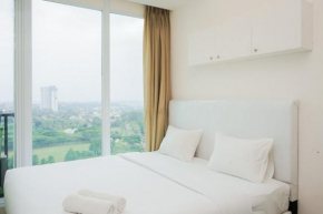 Homey and Cozy Studio Room at Tree Park City BSD Apartment By Travelio